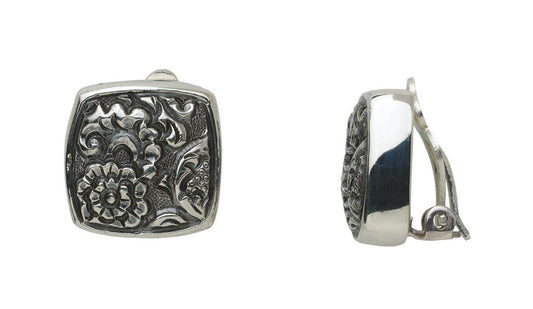 Sterling silver cushion square clip earrings with hand-carved floral repoussé, Sasha Collection 2003, Lori Bonn Archive.
