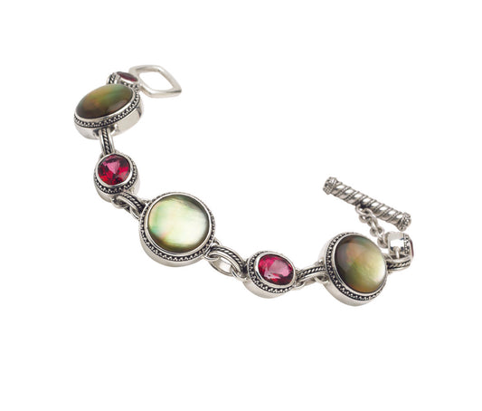 Sterling silver bracelet with black mother of pearl and gypsy red topaz in oval and round bezel-set links