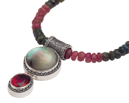Pendant necklace with black mother of pearl and gypsy red topaz on faceted tourmaline bead strand