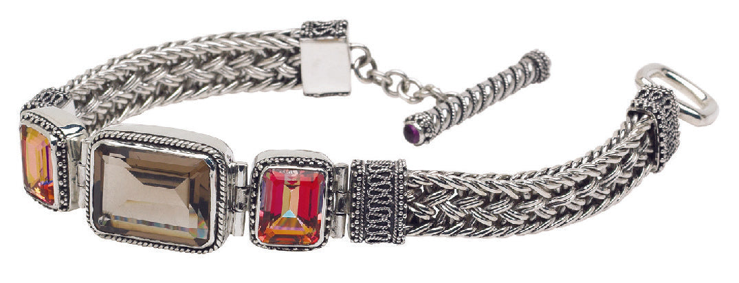 Sterling silver bracelet with rectangular twilight topaz and smoky quartz, linked by silver ikat patterns