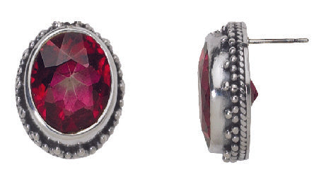 Faceted oval gypsy red topaz stud earrings with silver granulated bezel
