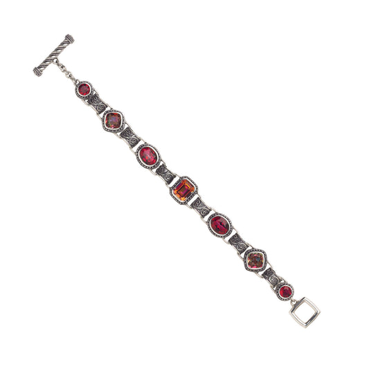 Sterling silver link bracelet with twilight and gypsy red topaz stones and filigree links