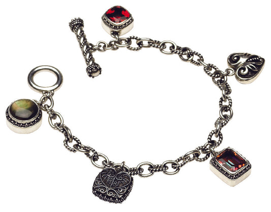 Sterling silver charm bracelet with twilight topaz, gypsy red topaz, and black mother of pearl in mixed handcrafted settings