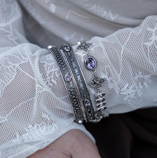 Sterling silver link bracelet with oval and marquis amethyst stones and granulated star links with toggle clasp, Heirloom Collection 2002, Lori Bonn Archive.
