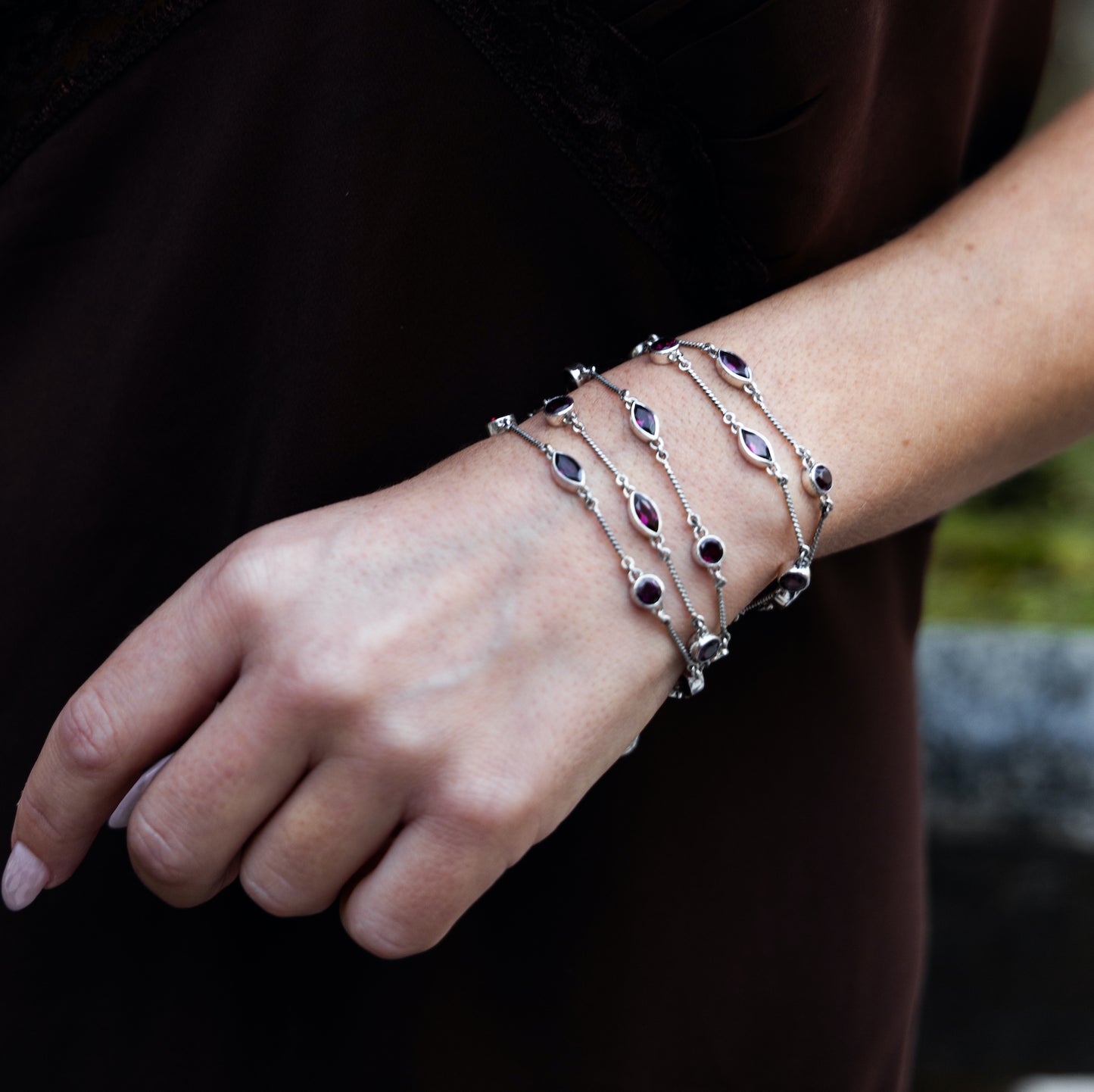 One-of-a-kind four-strand sterling silver toggle bracelet with faceted garnet stations from the Sasha 2003 Archive.