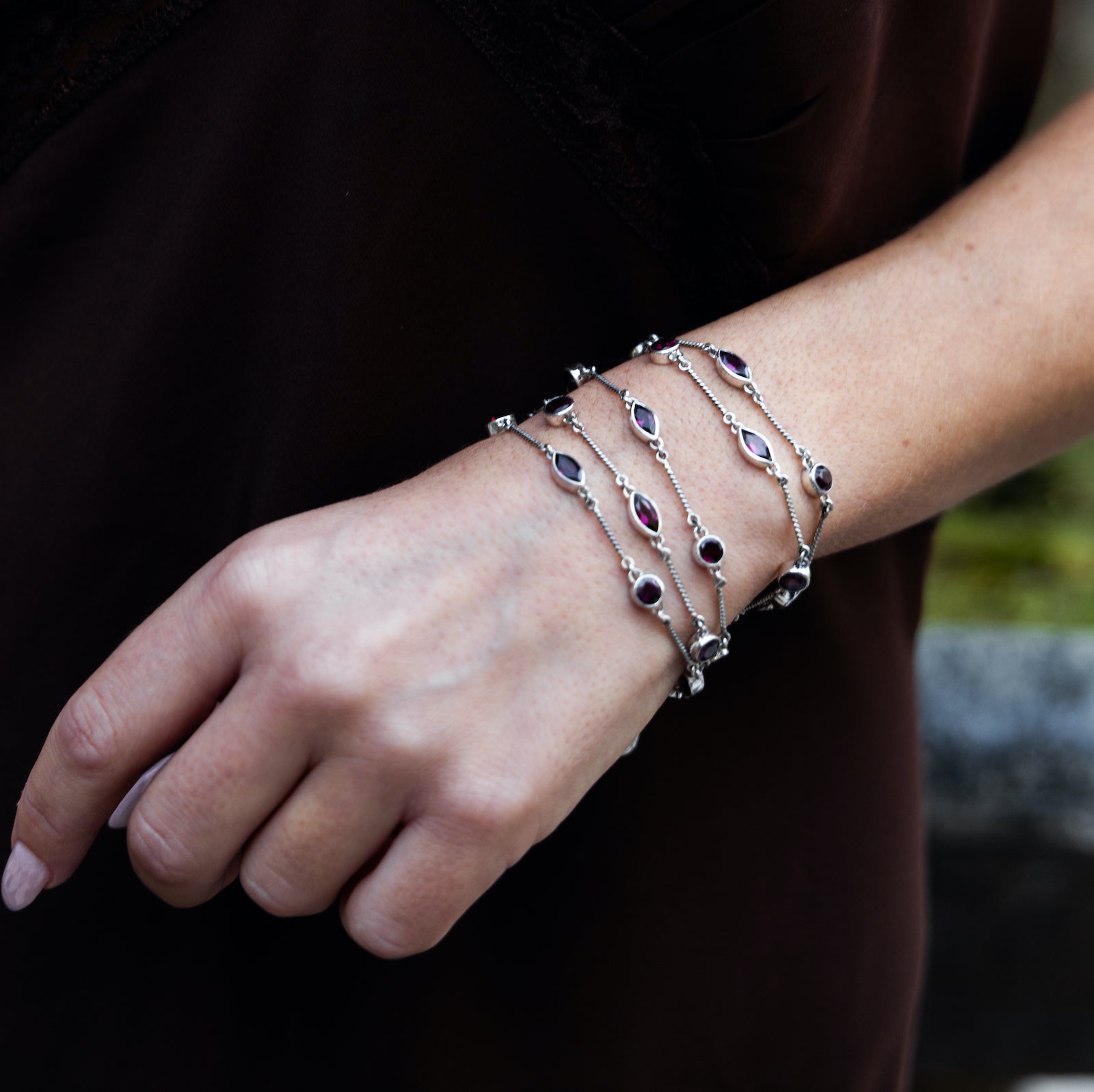 One-of-a-kind four-strand sterling silver toggle bracelet with faceted garnet stations from the Sasha 2003 Archive.