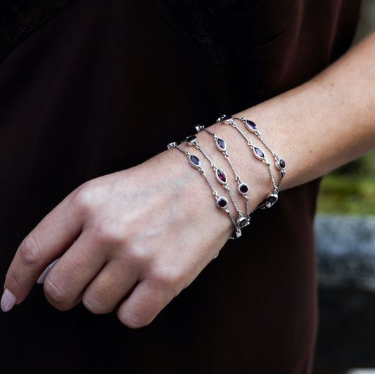 One-of-a-kind four-strand sterling silver toggle bracelet with faceted garnet stations from the Sasha 2003 Archive.