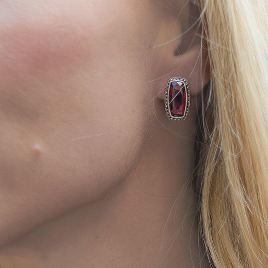 Sterling silver garnet post earrings with beaded detailing and a dimensional silhouette from the Sasha 2003 Archive.